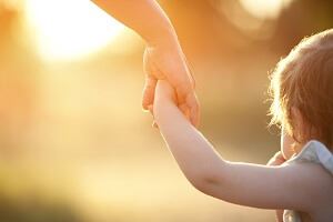 Parent Holding Their Childs Hand